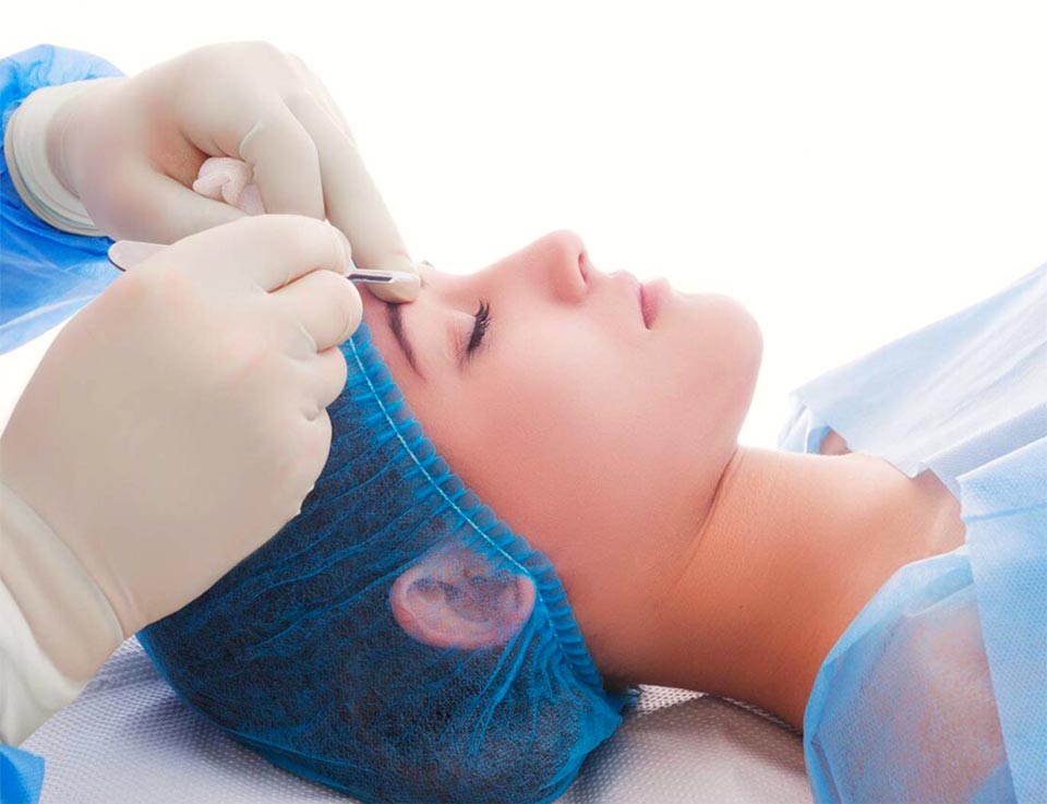 Picture of a female model patient undergoing a face treatment